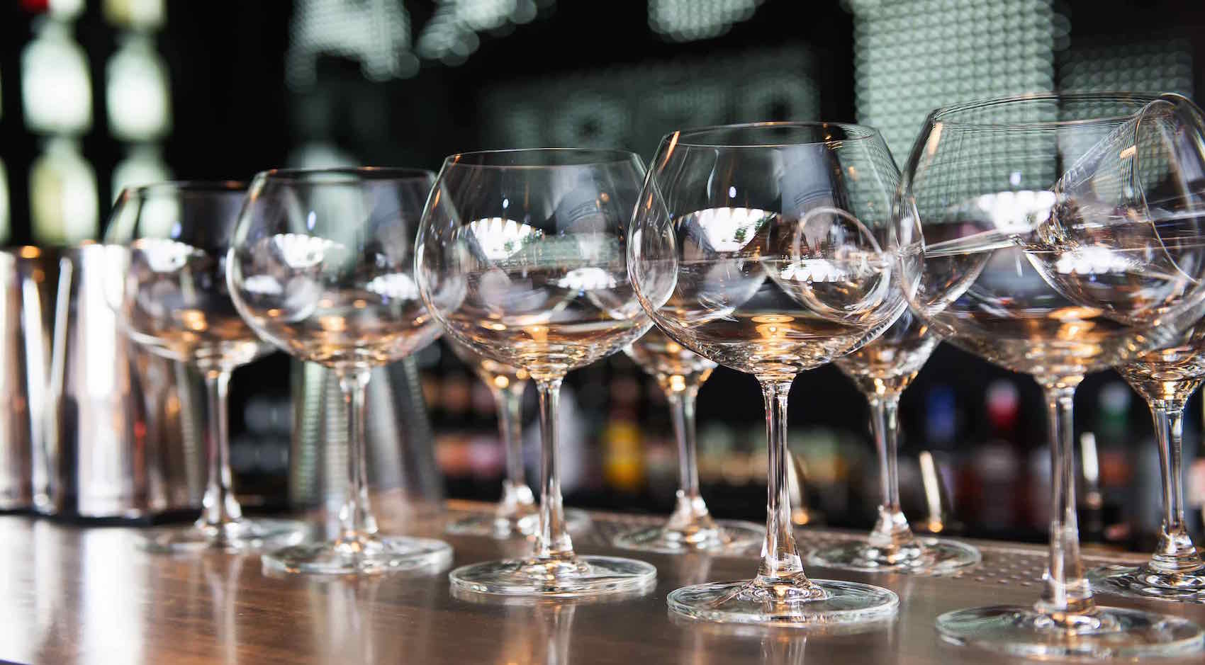 Wine glasses on a bar top 