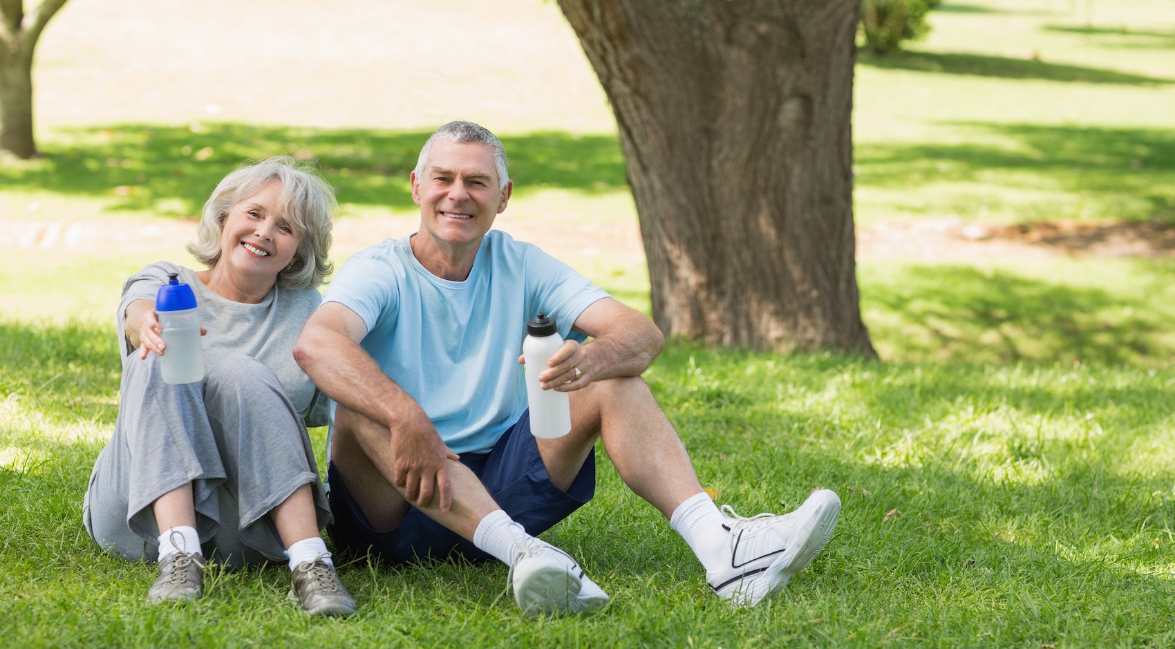 Elderly couple sitting in a park 